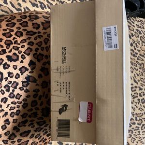 Michael Kors size 9 .Black with zipper top. Brand new never worn.